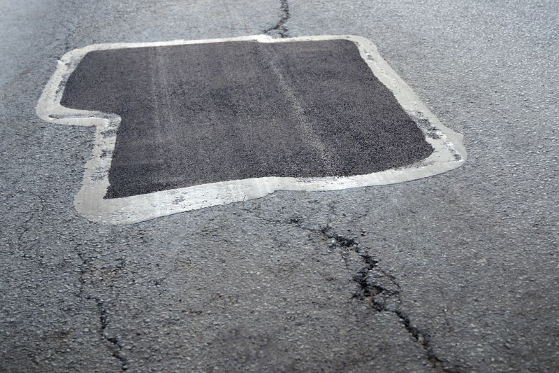How Weather Conditions Affect Asphalt Cracks And Potholes